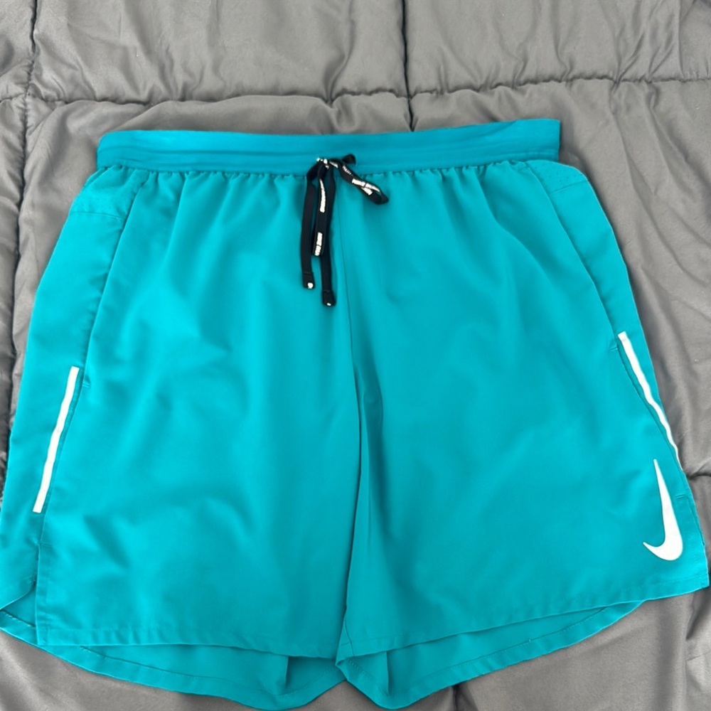 Nike Teal Athletic Shorts 7”
Work a couple times
